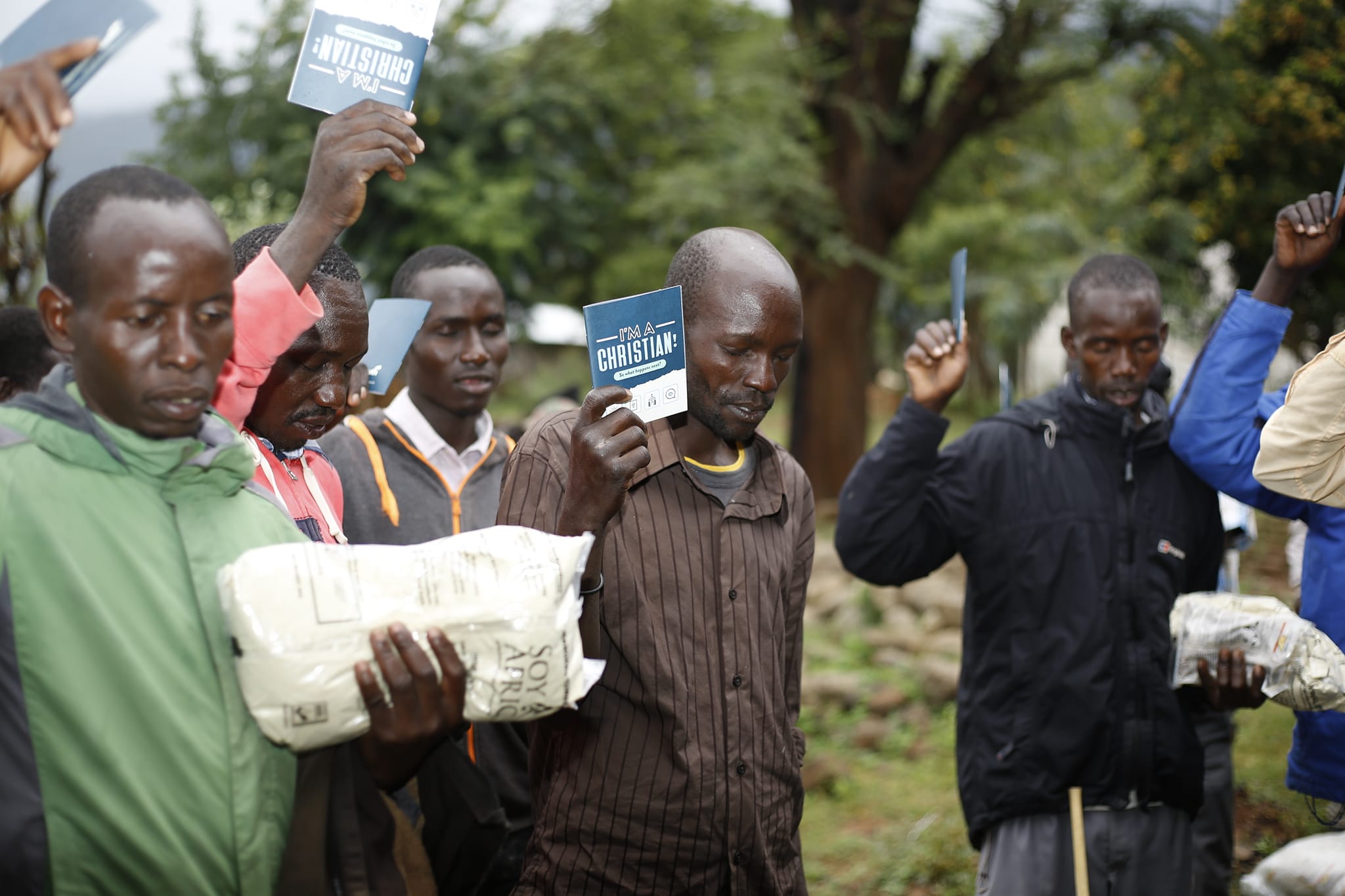 Kenyans Receiving Food And Receiving Christ