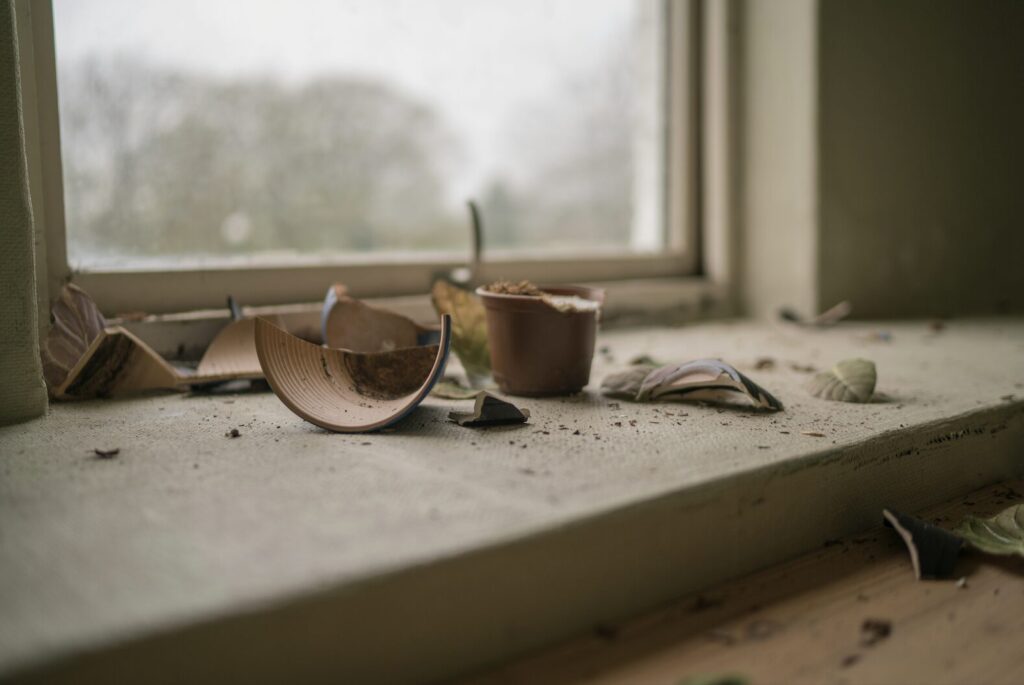 a window sill with broken planters